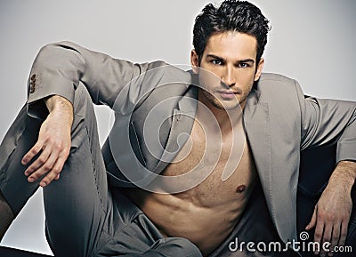 Elegant muscular man in fashion pose Stock Photo