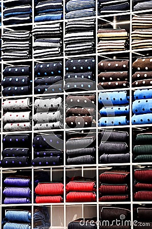 Elegant neckties on shelves in a store Stock Photo