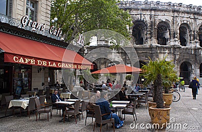 An elegant pavement cafe in the historic French city of Nimes, southern France Editorial Stock Photo