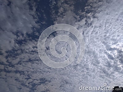 An elegant snapshot of a sublime view of a perfect pattern of shining clusters of white clouds Stock Photo