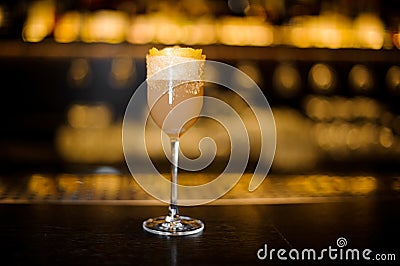 Elegant sweet wine glass filled with tasty brandy crusta cocktail on the bar counter Stock Photo