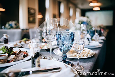 Elegant table setting for a wedding dinner in a restaurant. Blue glasses Stock Photo