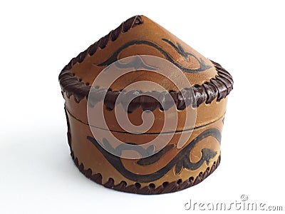 Elegant traditional Moroccan round leather box with lid. Arabic handicraft on white background Stock Photo