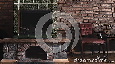Elegant vintage living room decoration relaxing antique fireplace with wooden upholstered armchair and old vintage telephone Stock Photo