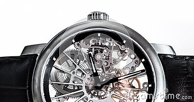 Elegant watch with visible mechanism, clockwork close-up. Stock Photo