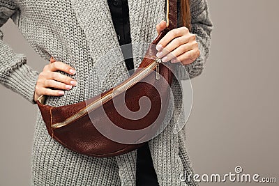 Elegant woman with a leather fanny pack Stock Photo