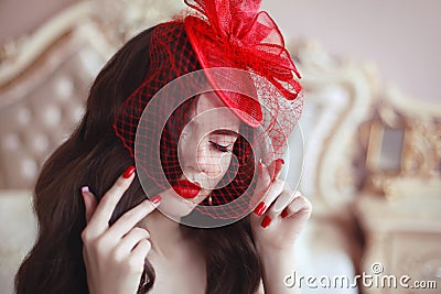 Elegant woman in retro hat with red lips and manicured nails. Br Stock Photo