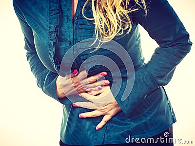 Elegant woman with stomach ache Stock Photo