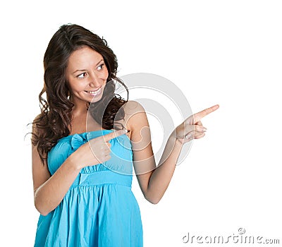 Elegant young woman pointing to the right Stock Photo