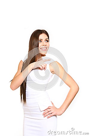 Elegant young woman pointing to the right on a white background Stock Photo