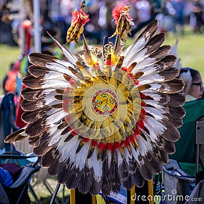 A shield decorated with feathers - element of a traditional Native America Costume - Stock Photo