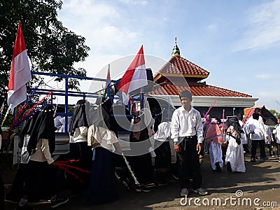 Elementary school children's parade in commemoration of the Prophet Muhammad's Isra and Miraj Editorial Stock Photo