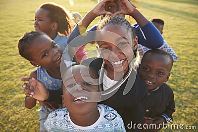 Elementary school kids having fun outdoors, high angle Stock Photo