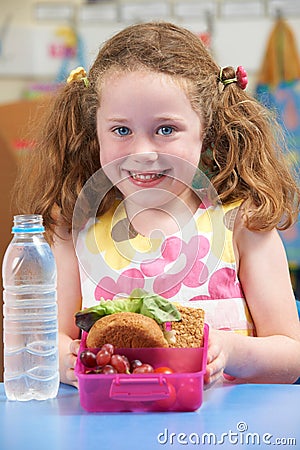 Elementary School Pupil With Healthy Lunch Box Stock Photo