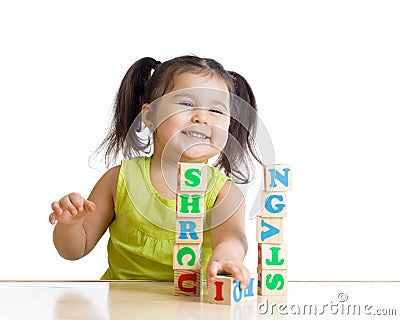 Elementary school student playing letter blocks Stock Photo