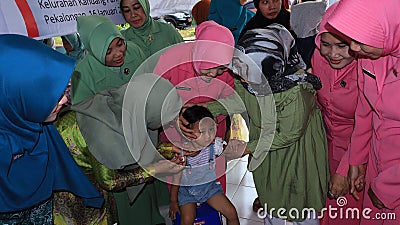 Elementary school students being given polio vaccine droplets Editorial Stock Photo