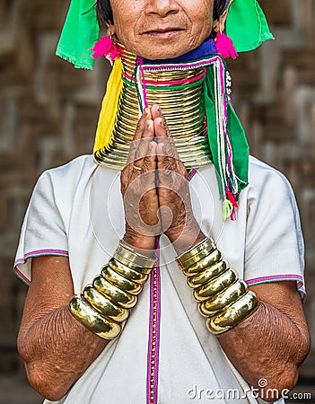 Elements of traditional female jewelry of the Padaung people rings on the neck and bracelets on the hands. Editorial Stock Photo