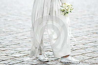 Elements of a woman`s casual suit with a bouquet of callas Stock Photo