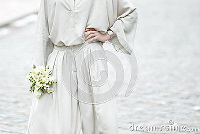 Elements of a woman`s casual suit with a bouquet of callas Stock Photo