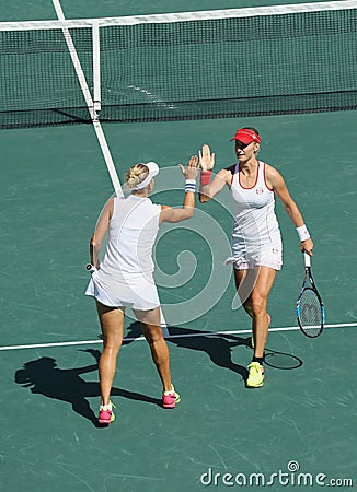 Elena Vesnina (L) and Ekaterina Makarova of Russia in action during women's doubles final of the Rio 2016 Editorial Stock Photo