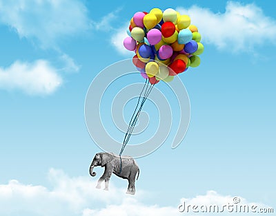 An elephant being lifted by balloons Stock Photo