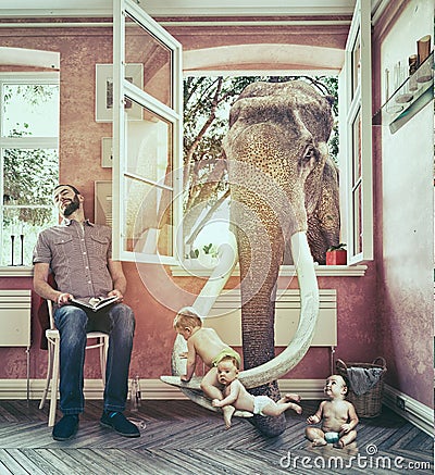 The elephant and the boy escapes Stock Photo