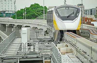 Elevated monorail train on rail. Public transit monorail. Modern mass transit. Electric vehicles. Rail transportation. Urban Editorial Stock Photo