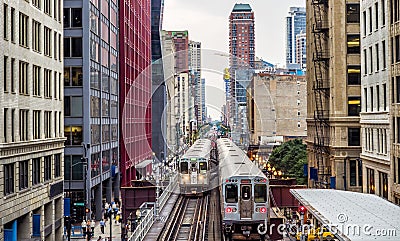 Elevated Train Tracks above the streets and between buildings at The Loop - Chicago, Illinois Editorial Stock Photo