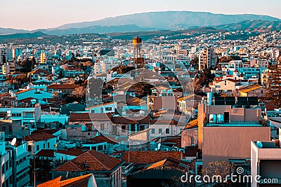 Elevated view above the Limassol Old Town with Water tower in the middle and Troodos mountains on background. Cyprus Stock Photo