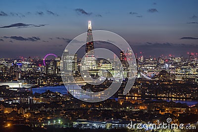 Elevated view to the illuminated, urban skyline of London Editorial Stock Photo