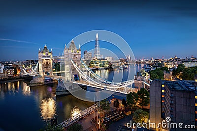 Elevated view to the illuminated, urban skyline of London, UK, during night time Editorial Stock Photo