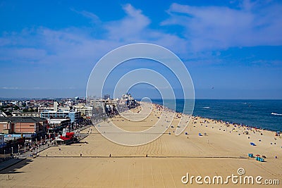 Elevated view of wide strip of sand along the boardwalk and ocean Editorial Stock Photo