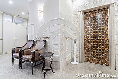 elevator access area and lounge chairs in the luxury hotel Stock Photo