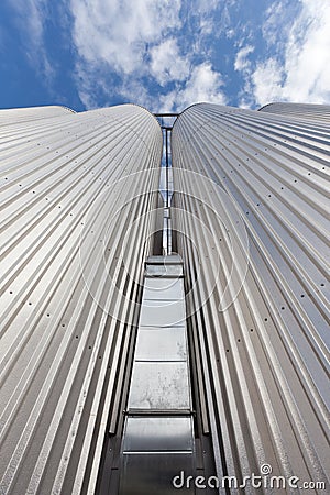 The Elevator is made of galvanized steel against the sky Stock Photo