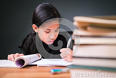 Child doing homework at home Stock Photo