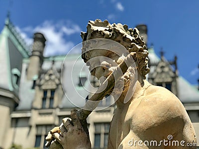 An elf plays a flute on Biltmore Estate in Asheville, North Carolina Editorial Stock Photo