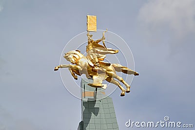 ELISTA, RUSSIA. A sculpture `The gold rider` against the background of the sky Editorial Stock Photo