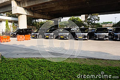 Elite Black Taxi waiting arrival passengers in front of Airport Gate Editorial Stock Photo