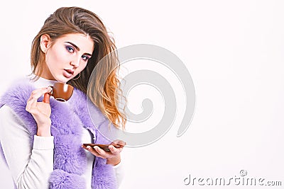 Elite drink with caffeine. Elite coffee concept. Woman makeup wear luxurious fur coat drink hot coffee. Pretty lady Stock Photo