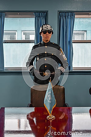 Elite Korean guard in the panmunjom blue house in Joint Security Area Editorial Stock Photo