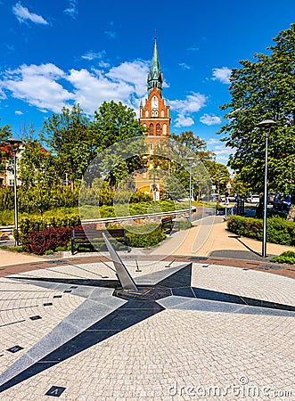 Holiest Heart of Jesus neo-gothic church at Wojska Polskiego street with Sundial Park in Elk town in Masuria region of Poland Editorial Stock Photo