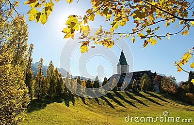 Ellmau castle, view through golden maple leaves Stock Photo