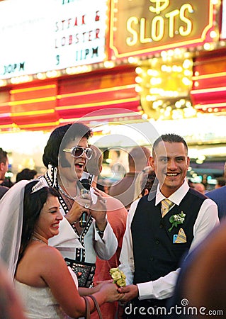 Elvis and a bride and groom in Vegas Editorial Stock Photo