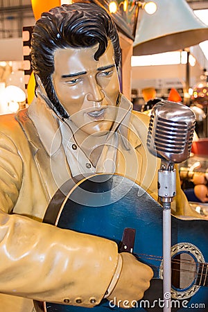 Elvis Presley Plastic statue with blue guitar an silver micropho Editorial Stock Photo