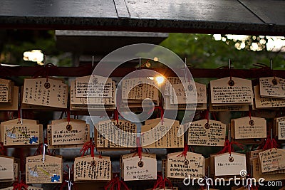 Ema are small wooden plaques, common to Japan, in which Shinto and Buddhist worshippers write prayers or wishes Editorial Stock Photo