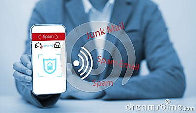 Email concept with laptop spam and virus computer monitor internet security concept,businessman hold mobile phone and protection s Stock Photo