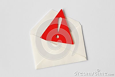 Email envelope with warning sign on white background Stock Photo