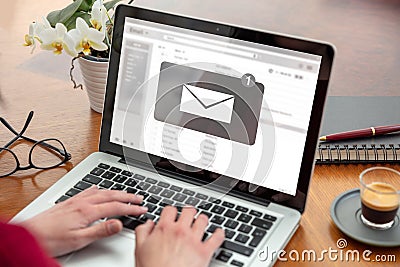 Email notification, woman hand on the computer laptop, one new inbox e mail message on the screen Stock Photo