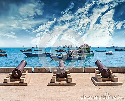 Embankment with guns in Zanzibar Stone Town with ocean on the ba Stock Photo
