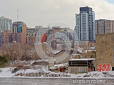 Embankment of Ottawa river with old industrial buildings, church and skyscrapers in Gatineau, Quebec, Canada Editorial Stock Photo